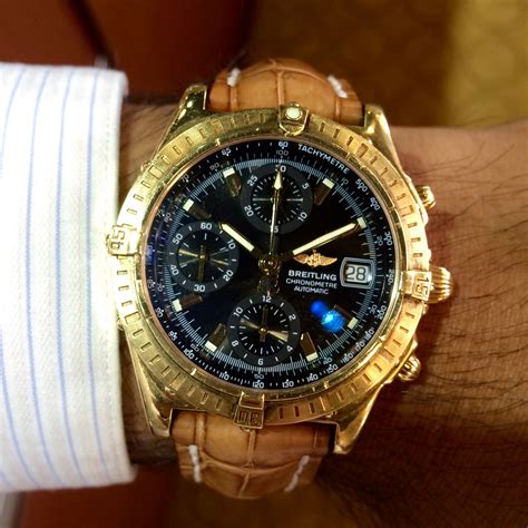 gold breitling chronomat.